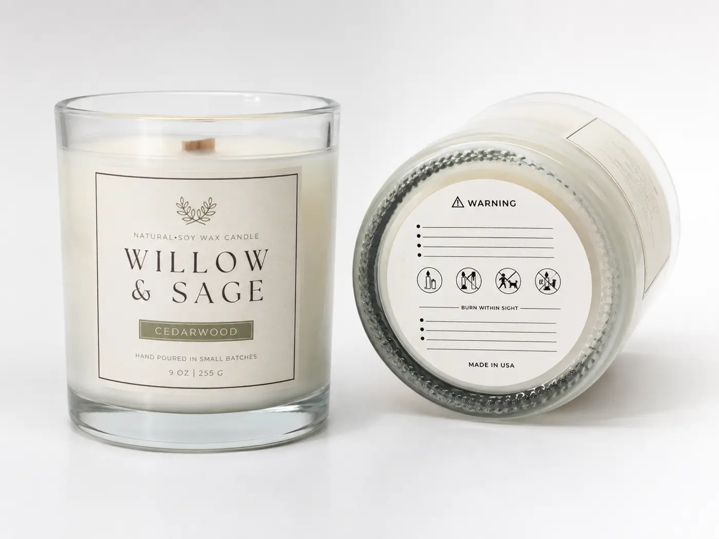 Candle jar with front branding label and bottom safety warning label